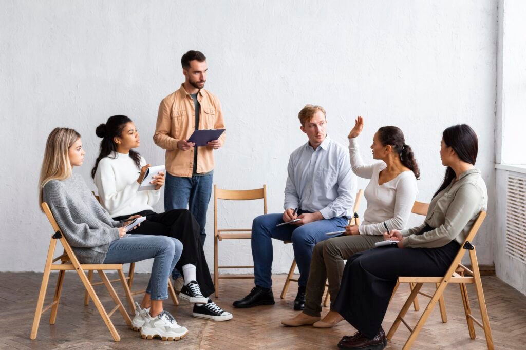 people attending group therapy session while sitting chairs